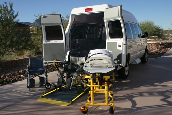 Stretcher and wheelchair equipment beside van